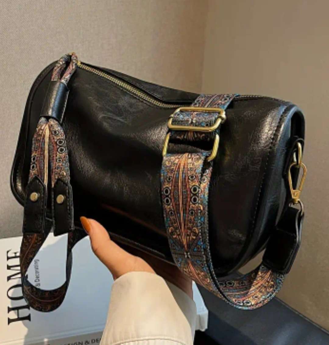 Black woman's shoulder sling handbag