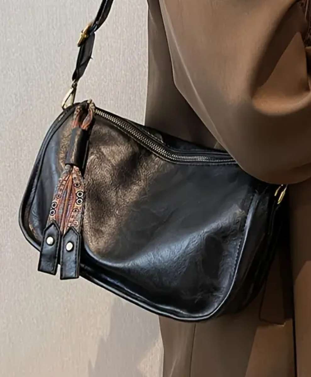 Black woman's shoulder sling handbag