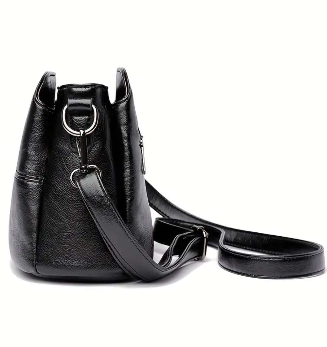 Black shoulder sling handbag