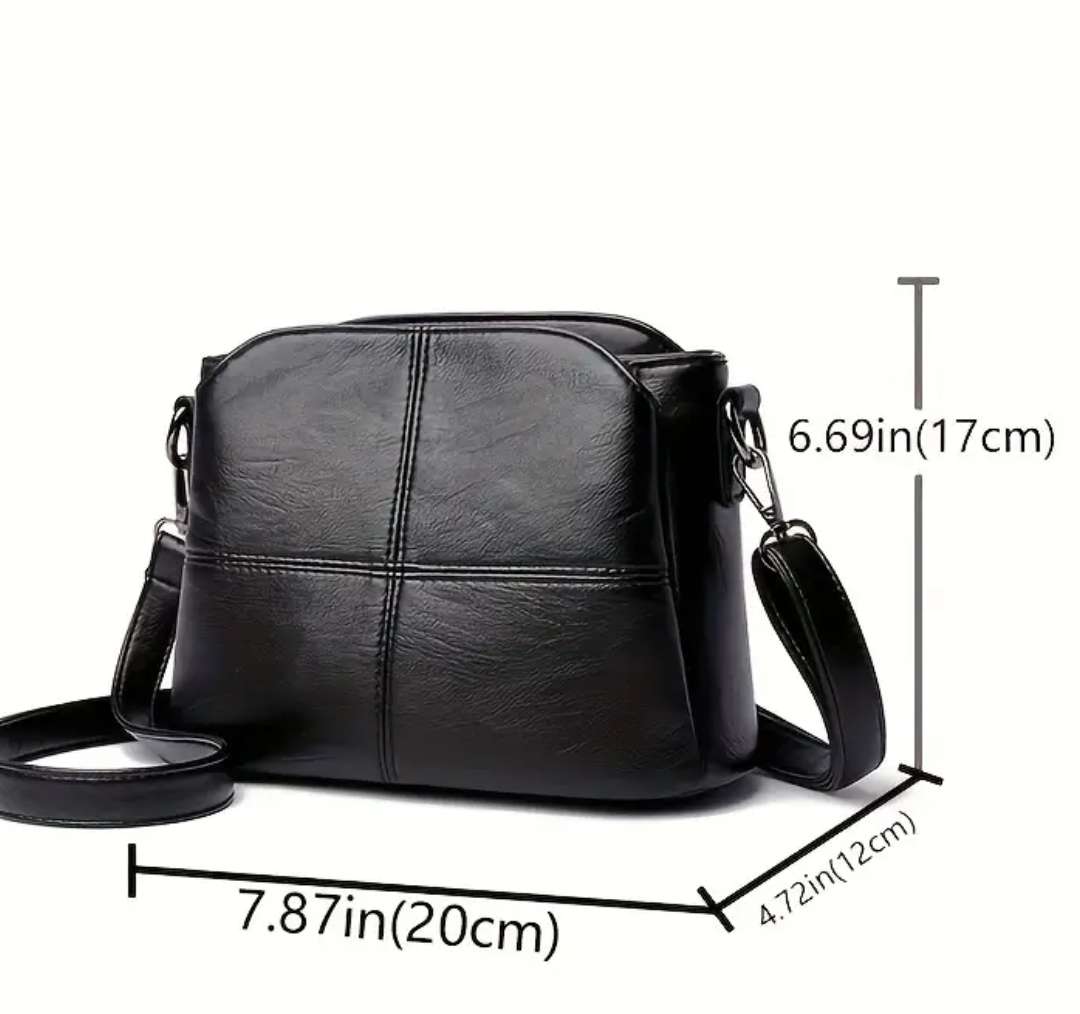 Black shoulder sling handbag
