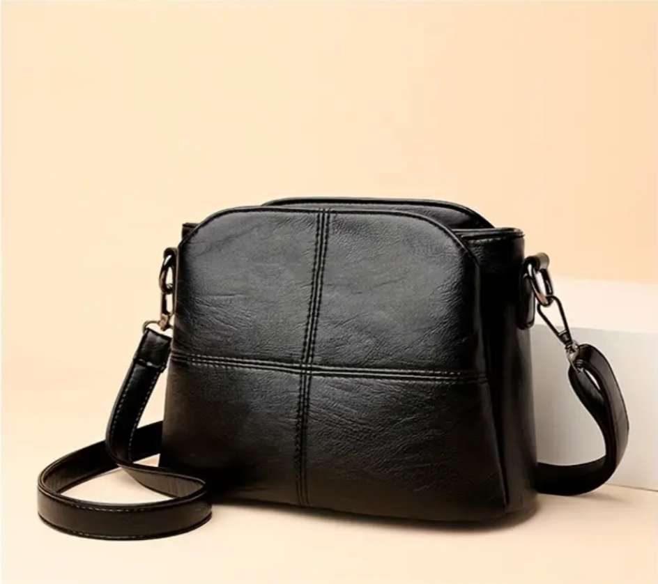 Black shoulder sling handbag