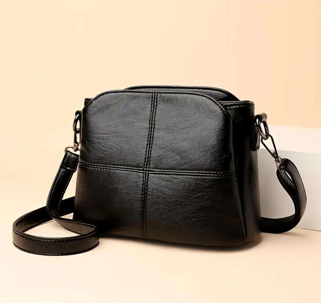 Womans shoulder sling handbag