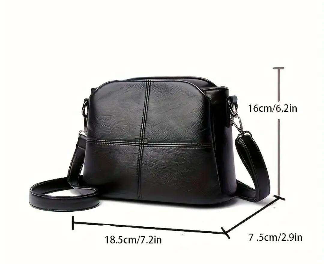 Womans shoulder sling handbag