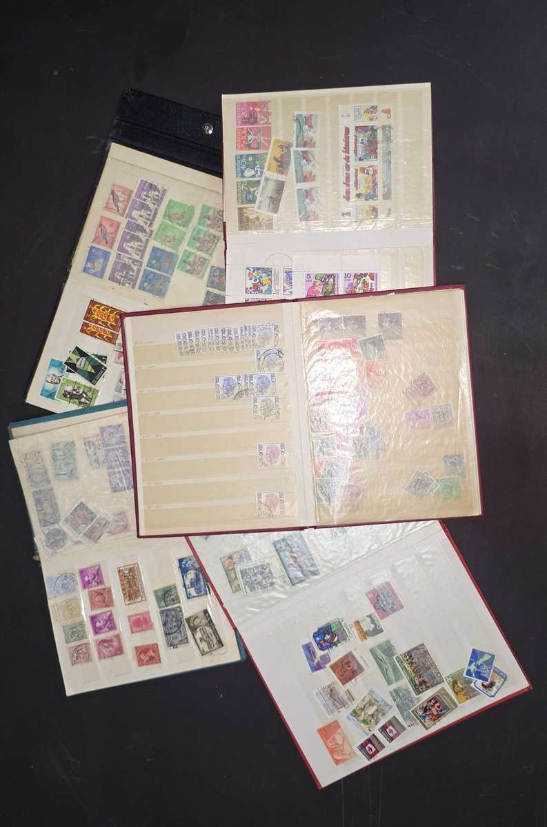 Stock Books: 5 Small Stock Books (Well Used) with Assorted World: Nice Starter!