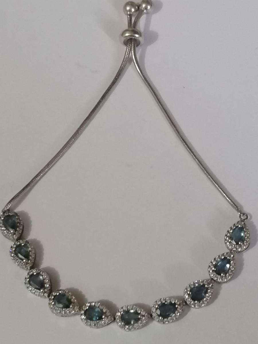 Stylish swivel locking snake chain bracelet, sterling silver with beautiful stones.