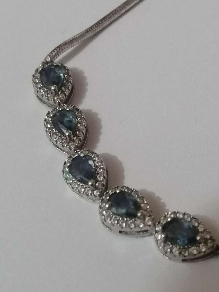 Stylish swivel locking snake chain bracelet, sterling silver with beautiful stones.