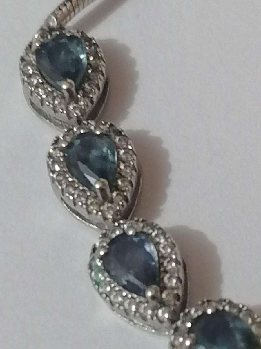 Stylish swivel locking snake chain bracelet, sterling silver with beautiful stones.