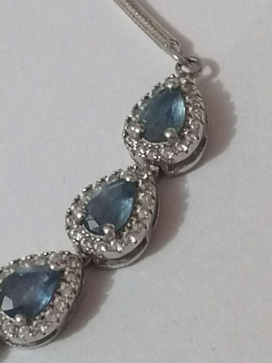 Stylish swivel locking snake chain bracelet, sterling silver with beautiful stones.