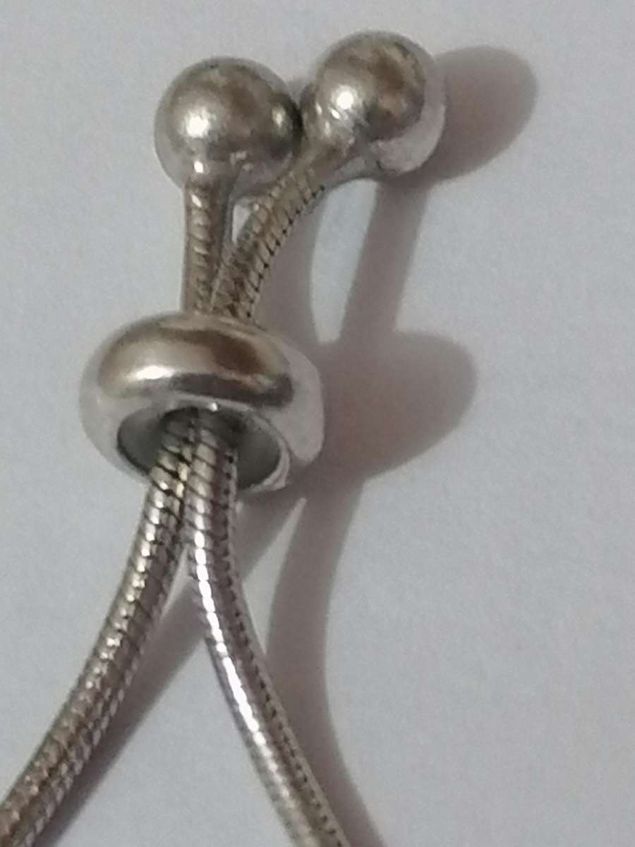 Stylish swivel locking snake chain bracelet, sterling silver with beautiful stones.