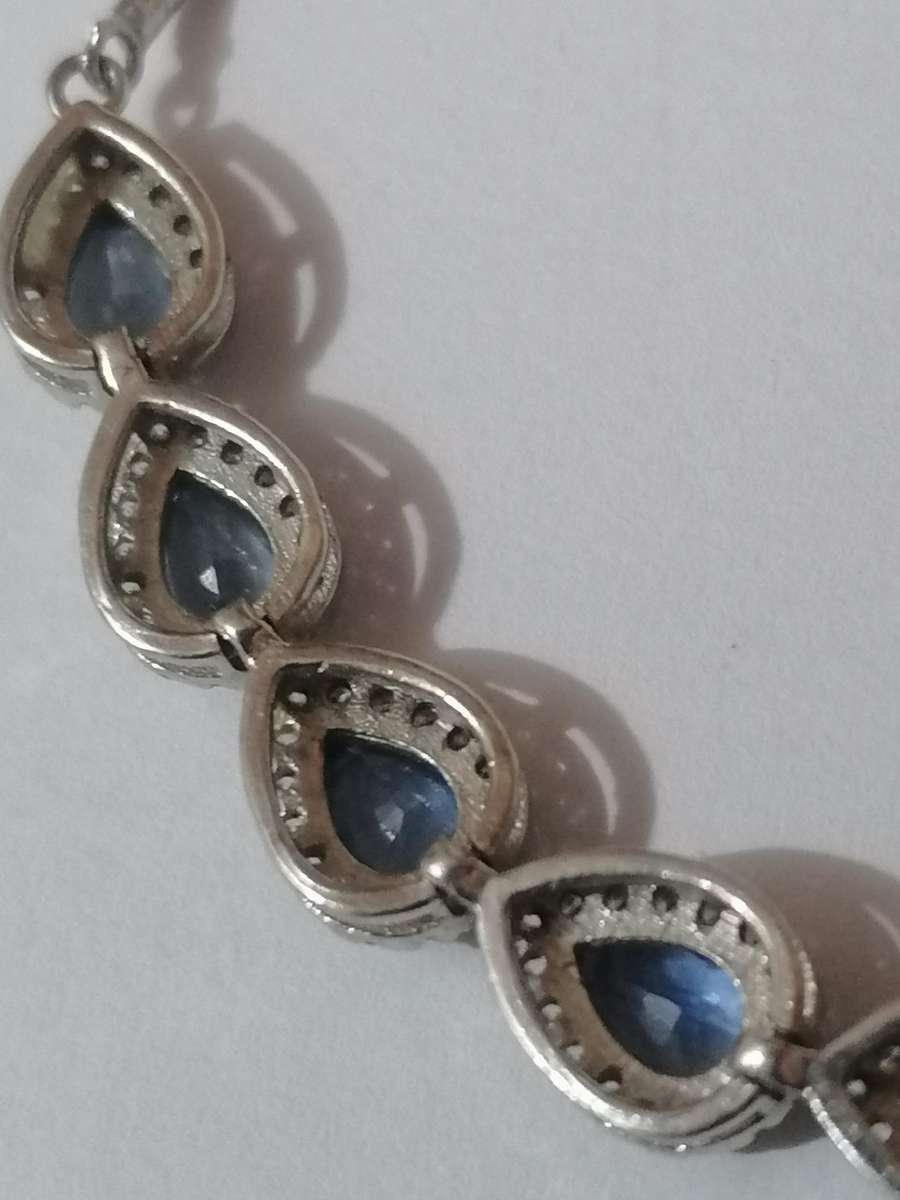 Stylish swivel locking snake chain bracelet, sterling silver with beautiful stones.