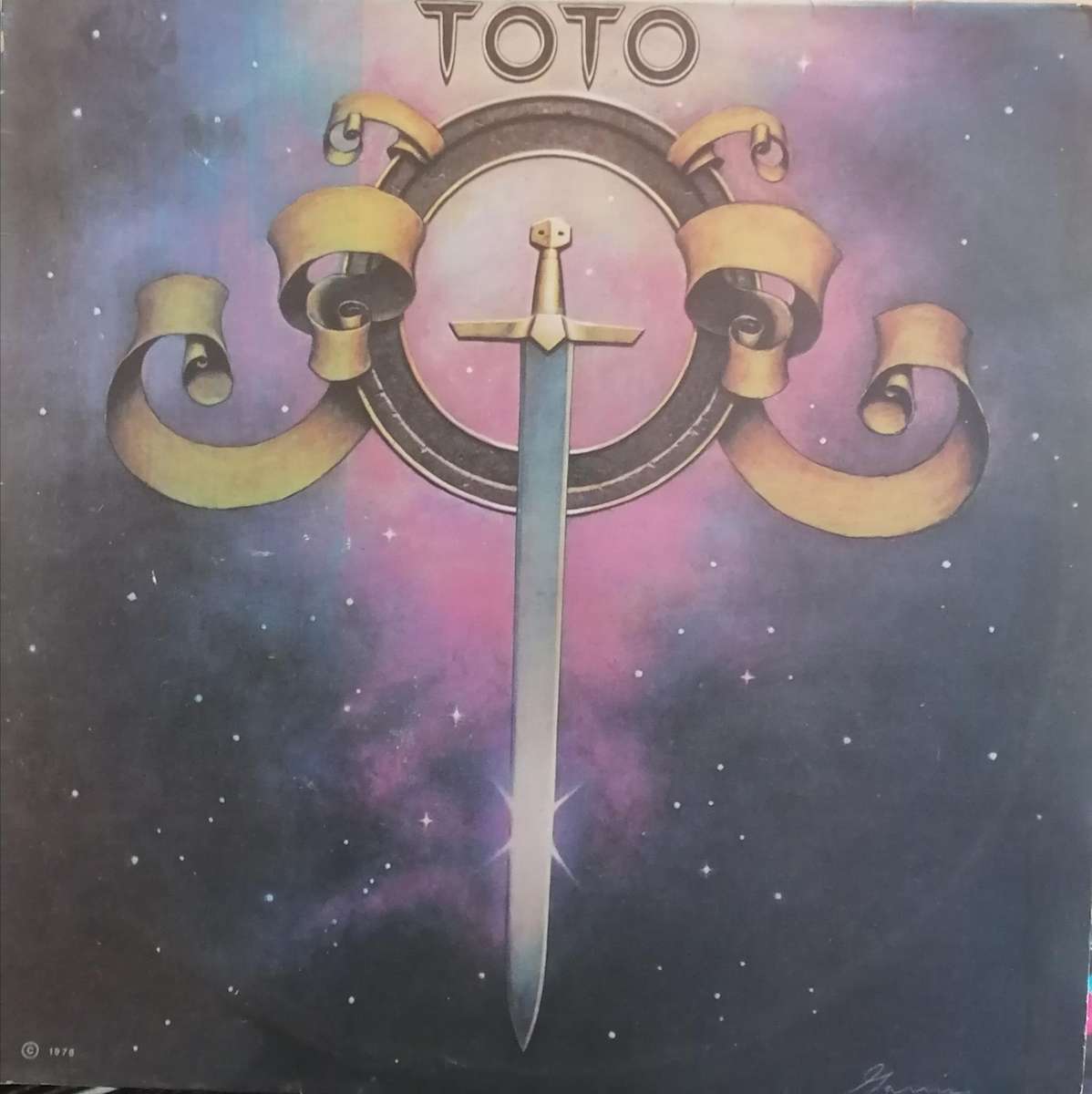 Toto, vinyl very good.