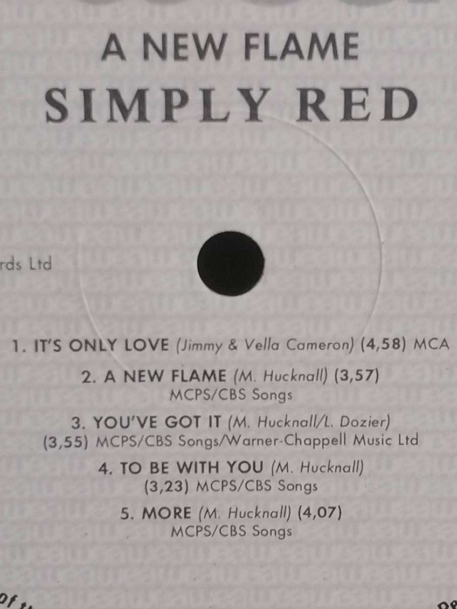 Simply Red, a New Flame, vinyl good.