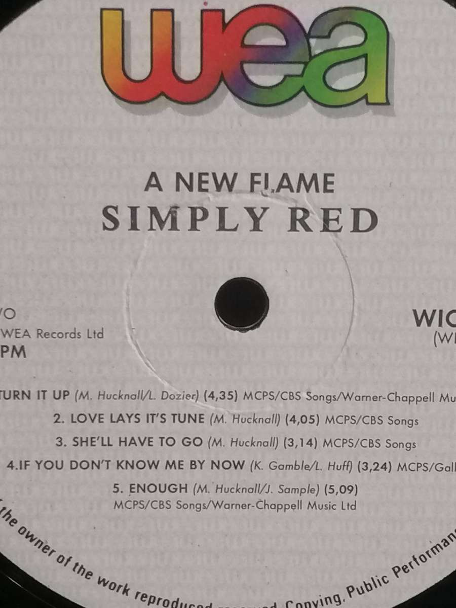 Simply Red, a New Flame, vinyl good.