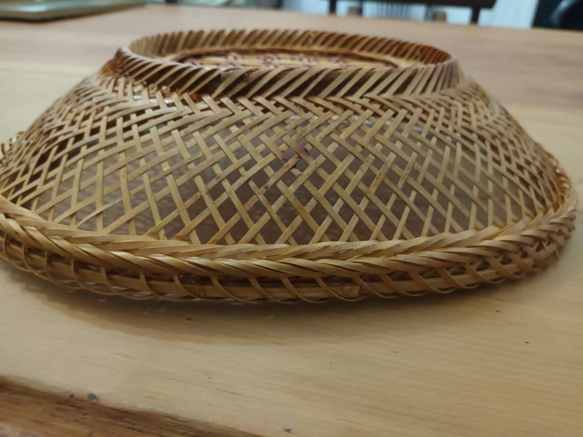 Small elliptical vintage wicker basket
