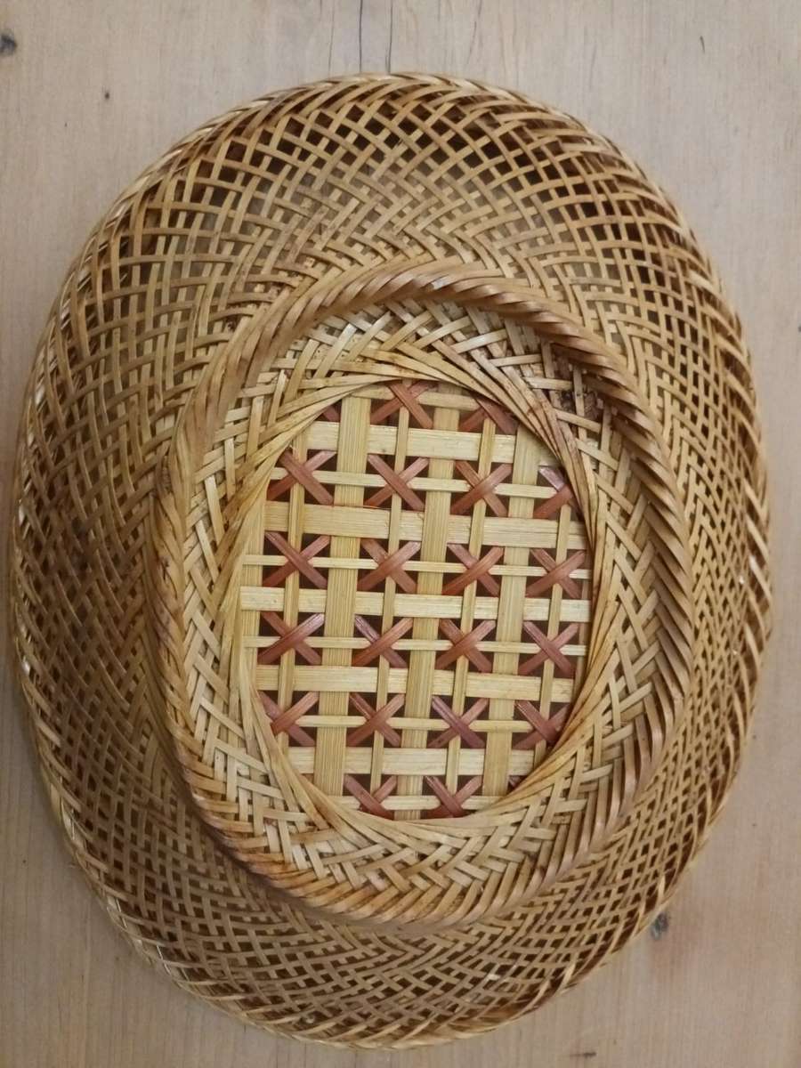 Small elliptical vintage wicker basket