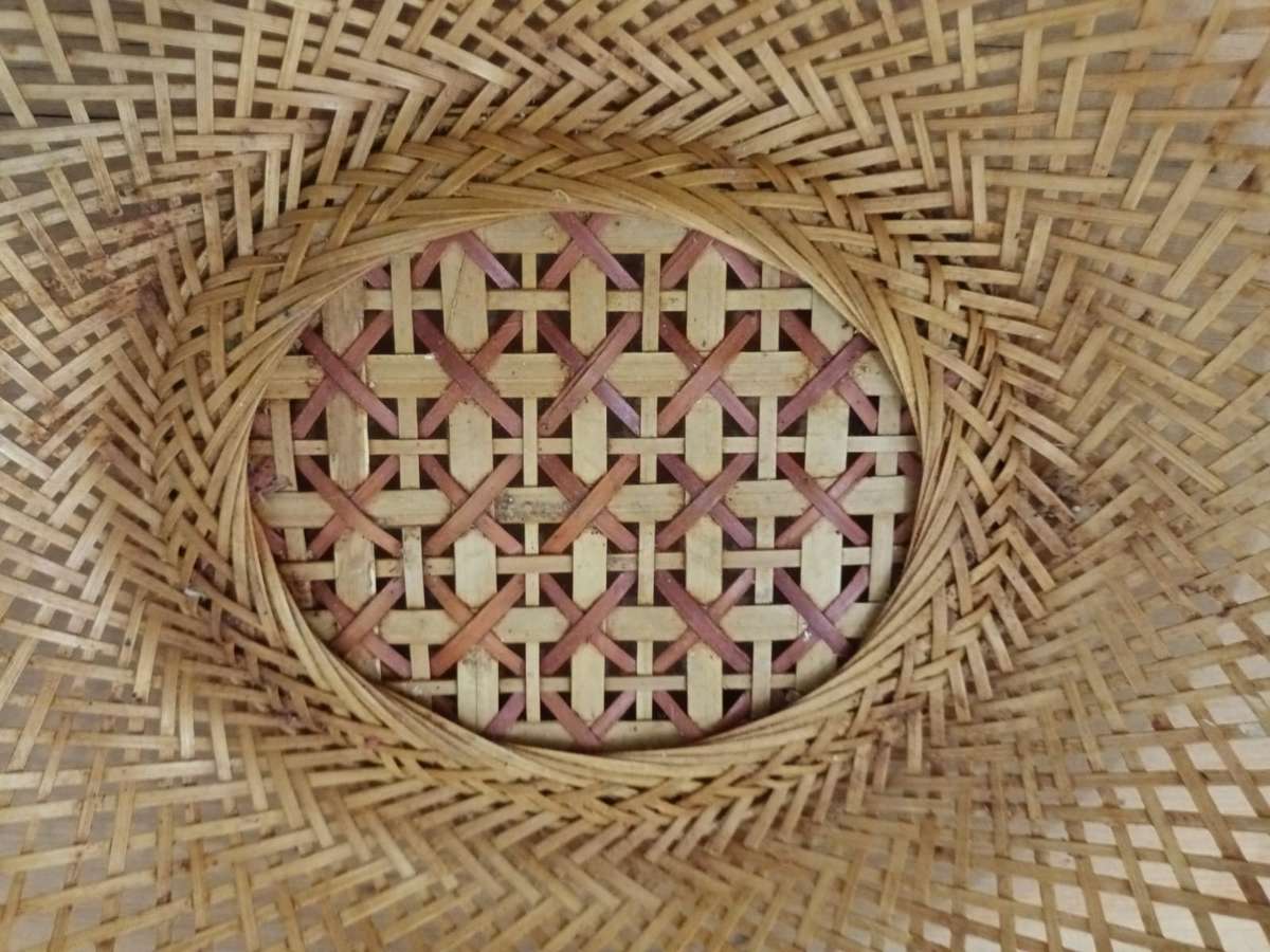 Small elliptical vintage wicker basket