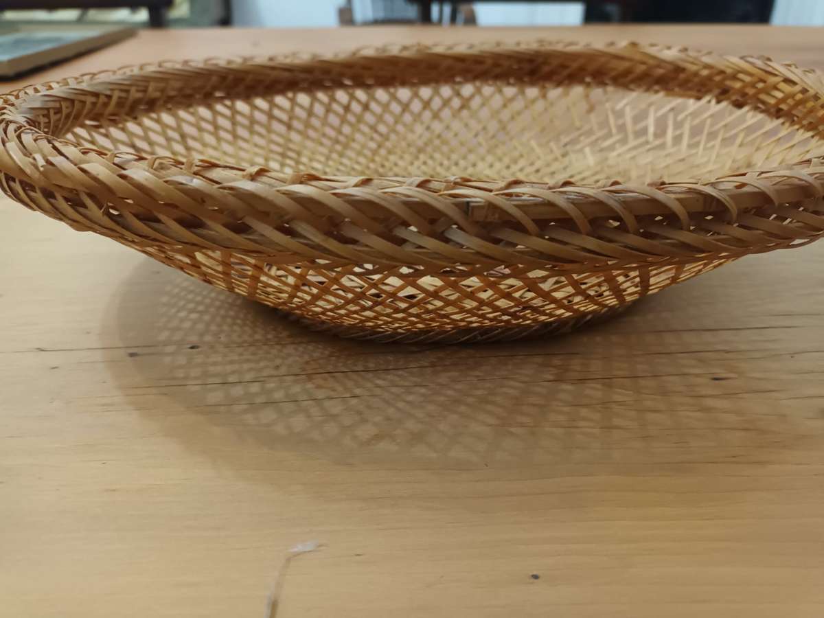 Small elliptical vintage wicker basket