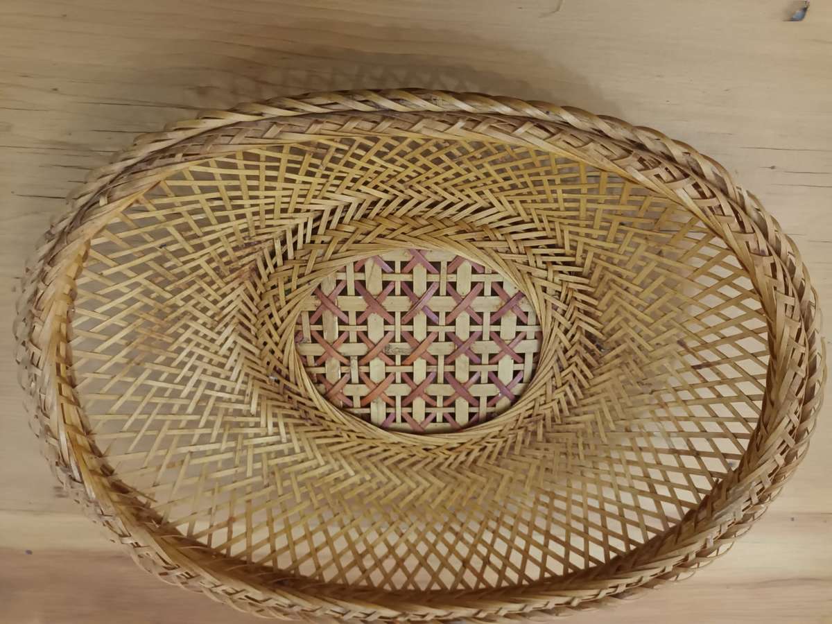 Small elliptical vintage wicker basket