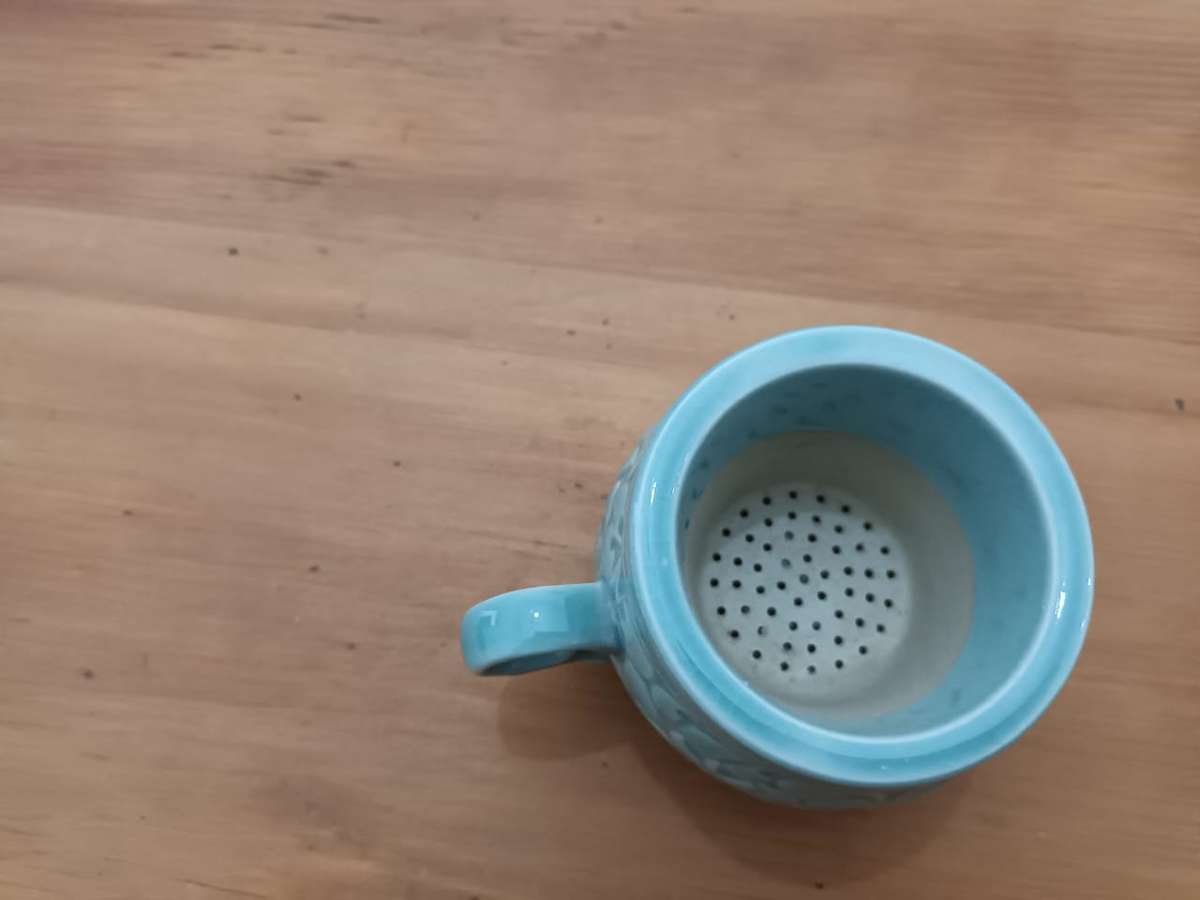 Vintage Korean celadon tea cup and matching ceramic infuser