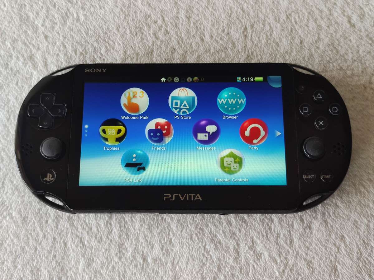 Playstation Vita Slim Console + 3 Games