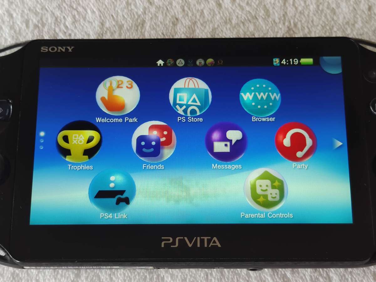 Playstation Vita Slim Console + 3 Games