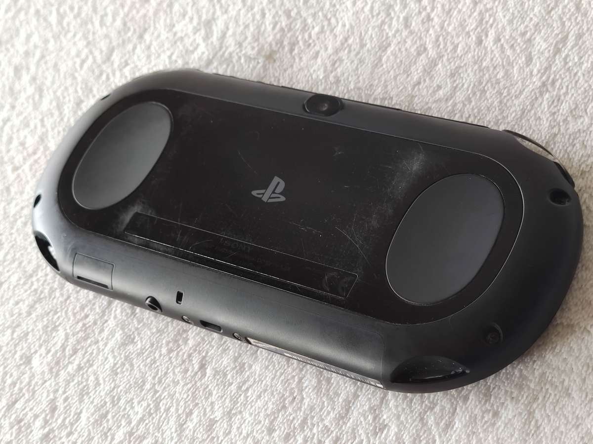 Playstation Vita Slim Console + 3 Games