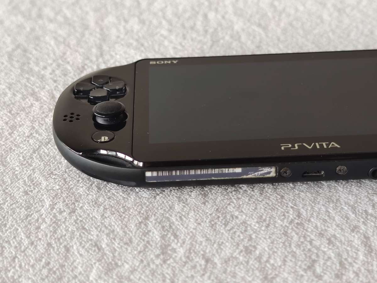 Playstation Vita Slim Console + 3 Games