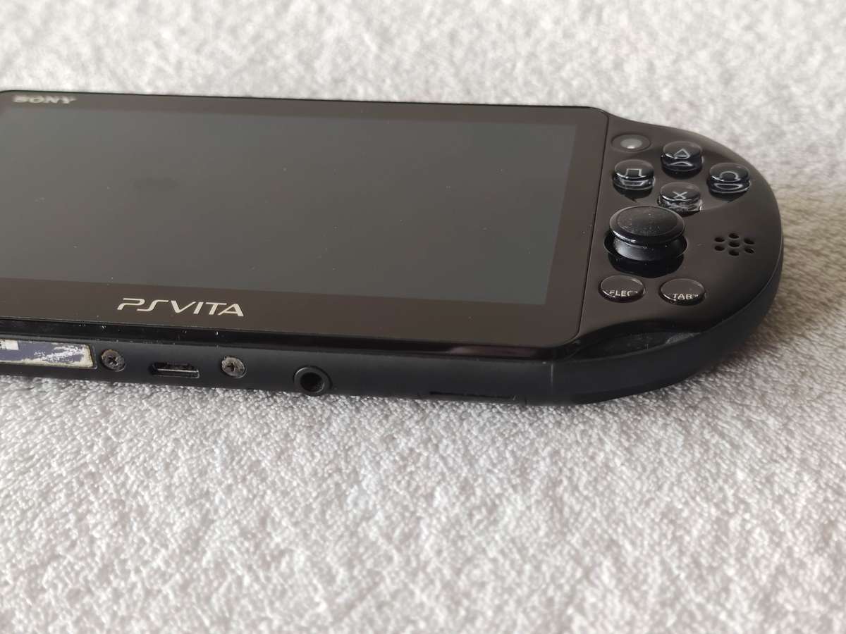 Playstation Vita Slim Console + 3 Games