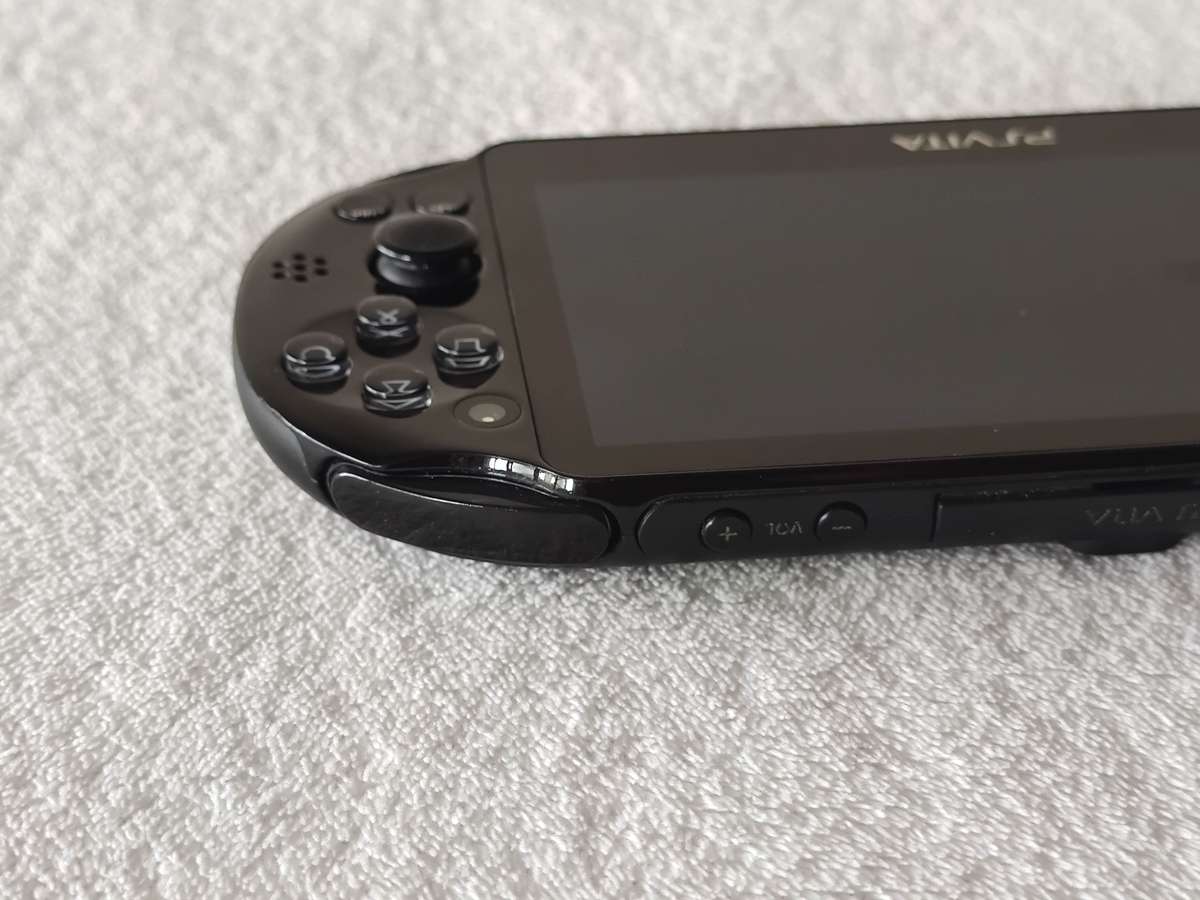 Playstation Vita Slim Console + 3 Games