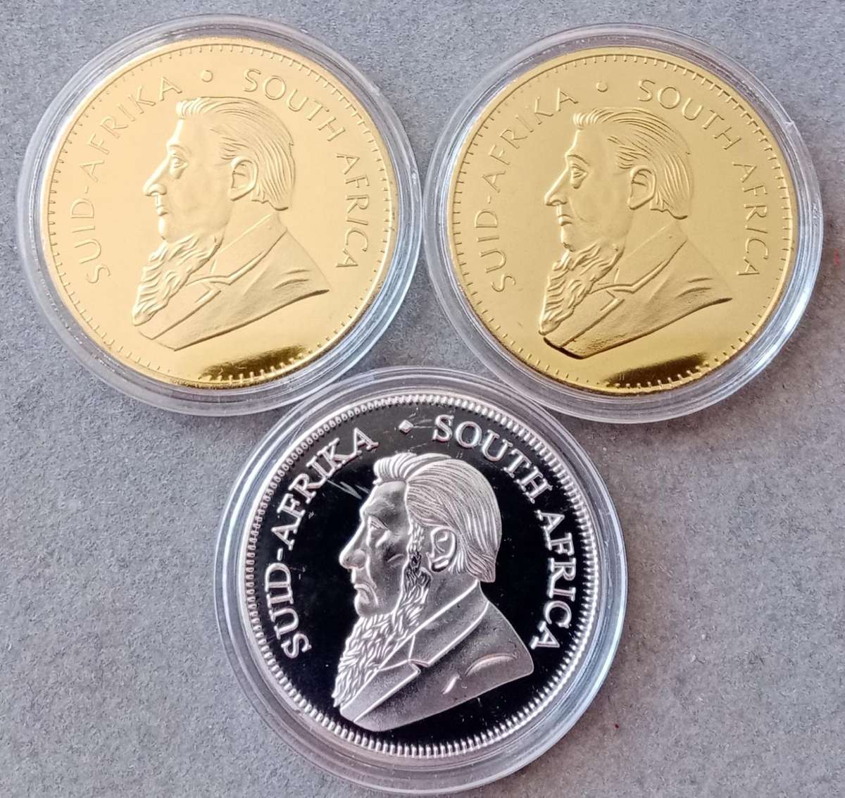 Lot of x3 Krugerrand 1oz replica coins in capsules (x2 gold & 1 silver)