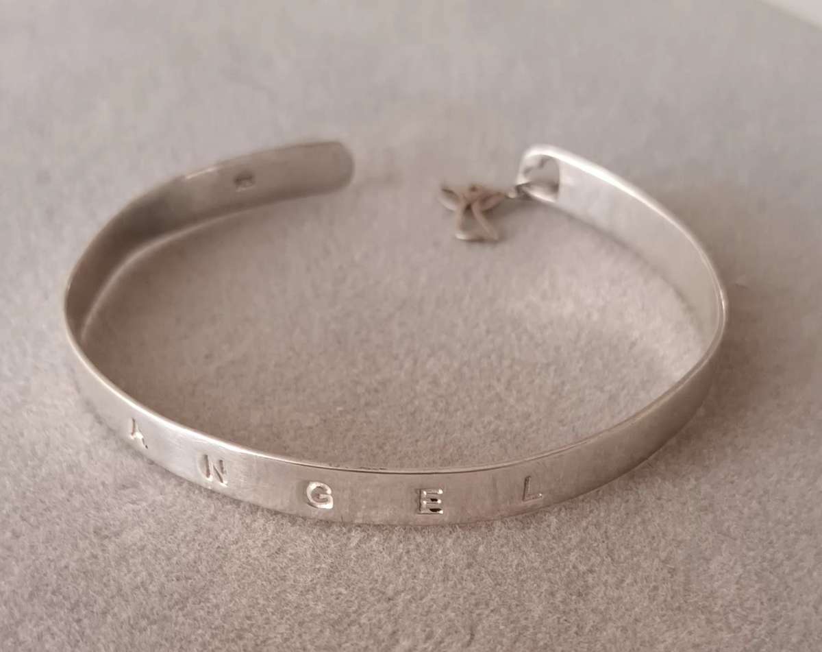 Sterling Silver Angel Bangle. 8.3g. 60mm. Width 5mm.