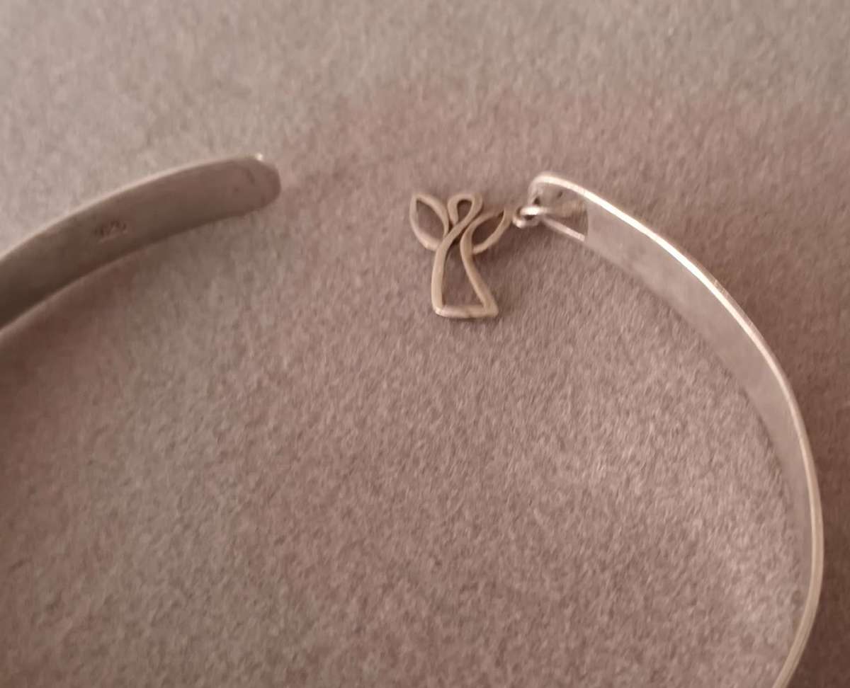 Sterling Silver Angel Bangle. 8.3g. 60mm. Width 5mm.
