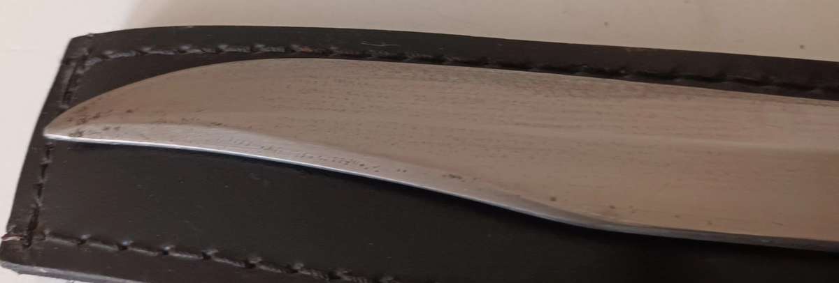 Steel Sword with Wood and Brass Handle.  Genuine Leather Pouch. Length 46cm.