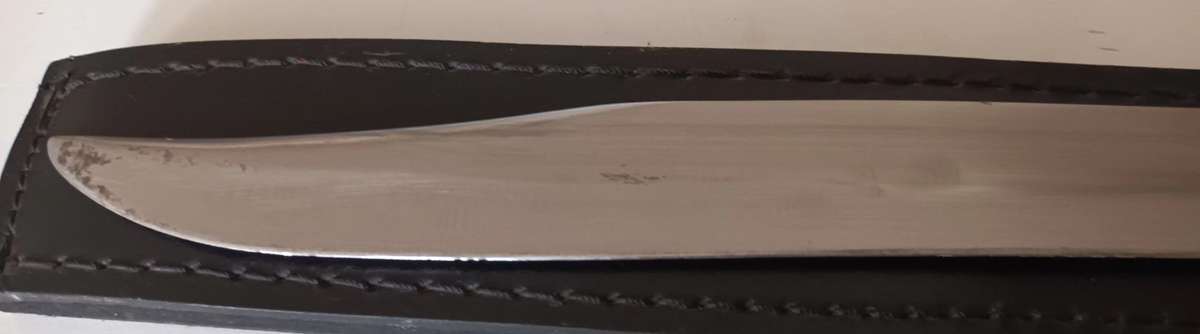 Steel Sword with Wood and Brass Handle.  Genuine Leather Pouch. Length 46cm.