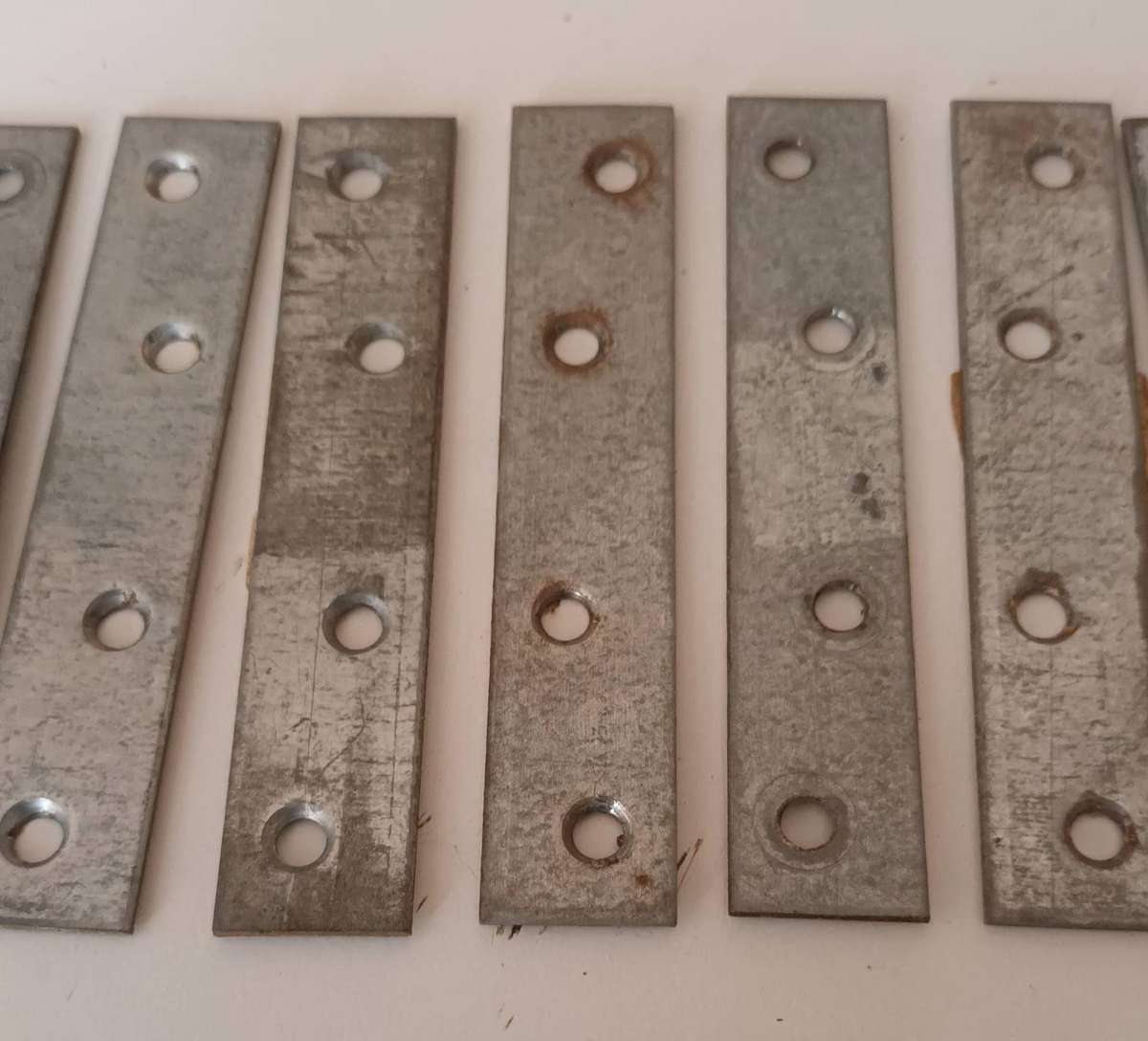 12x Mending Plates. Length 10cm. Width 2cm.