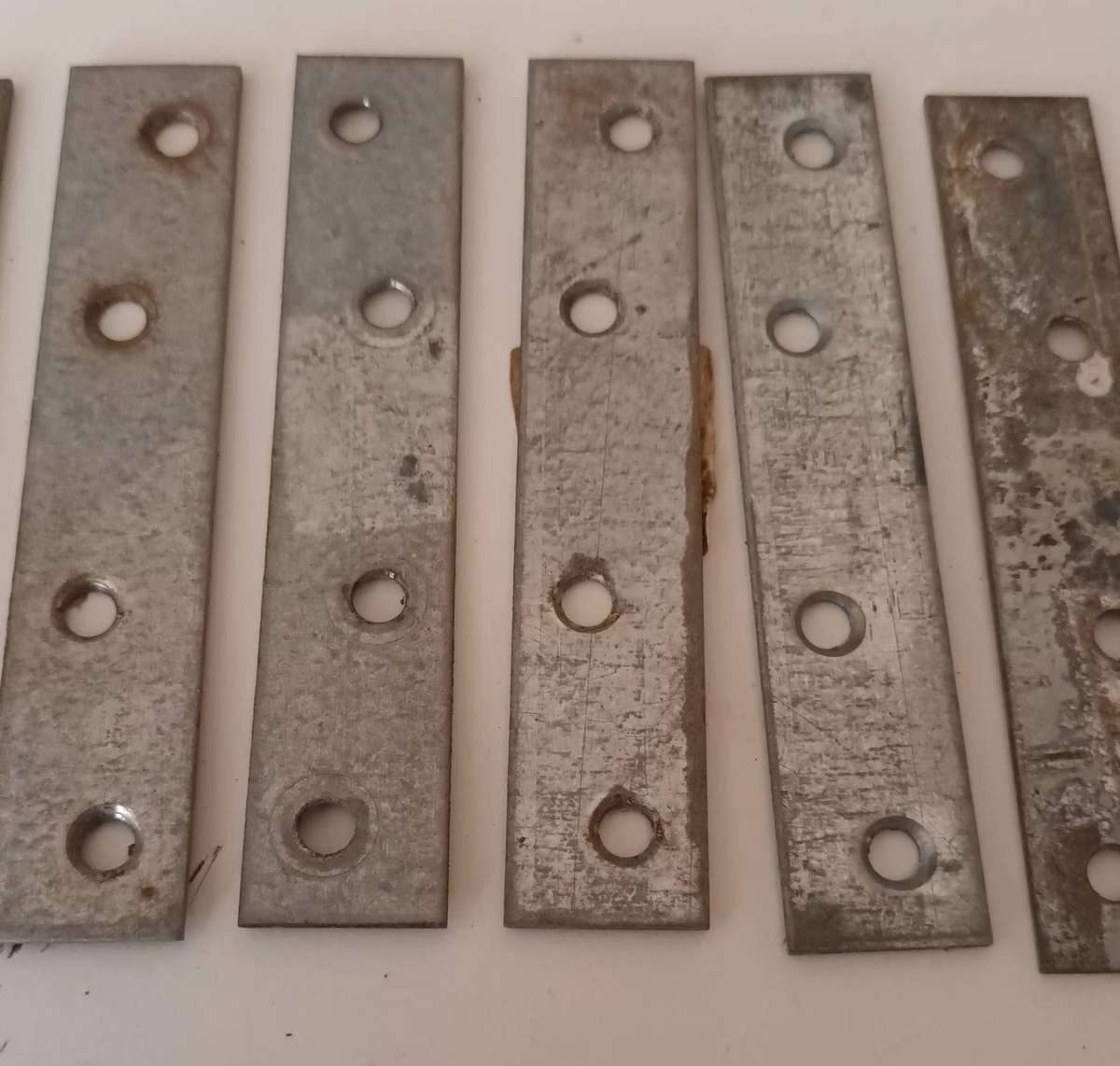 12x Mending Plates. Length 10cm. Width 2cm.