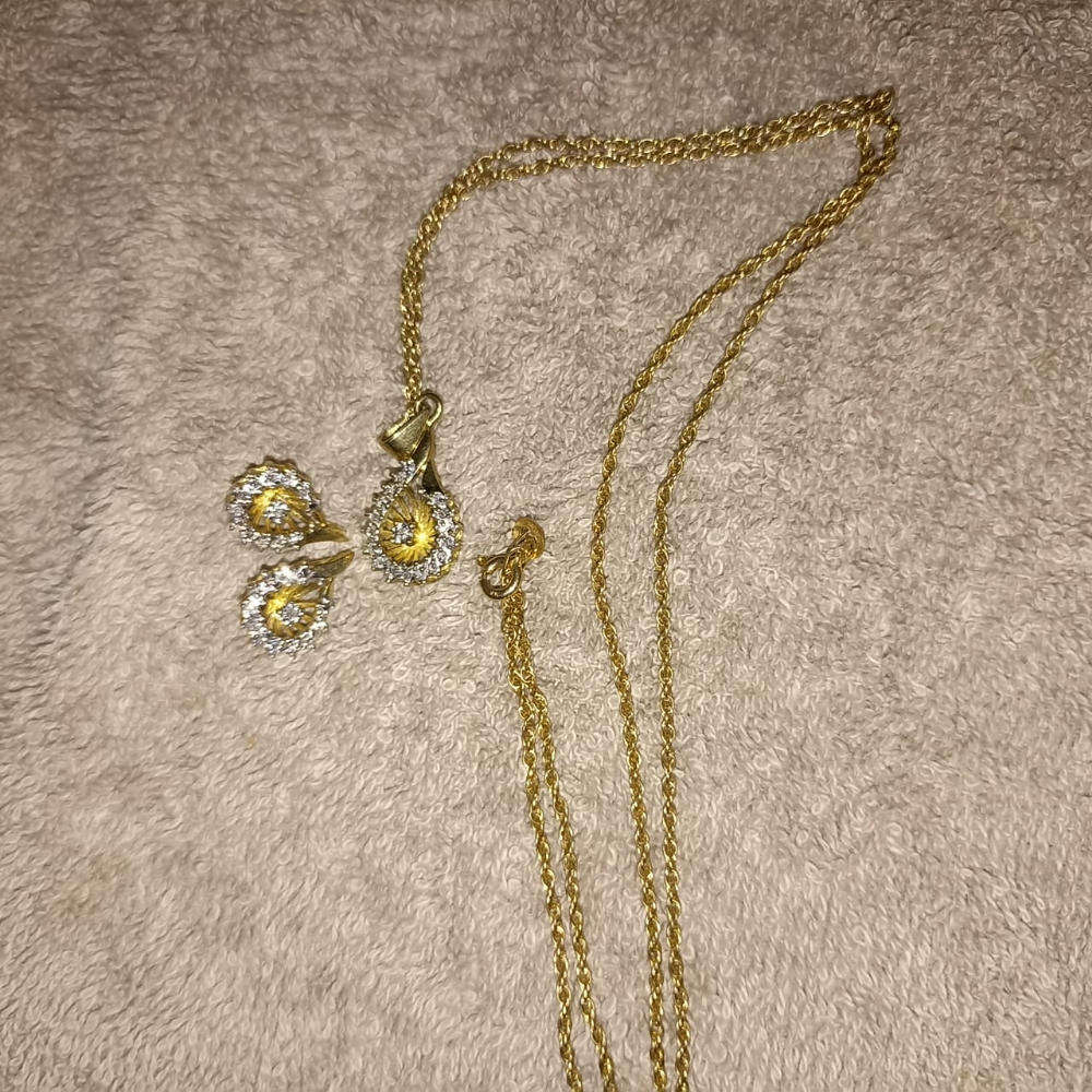 18 carat Angel diamond ring with 9 carat diamond earrings and pendant  rare to find as a set.