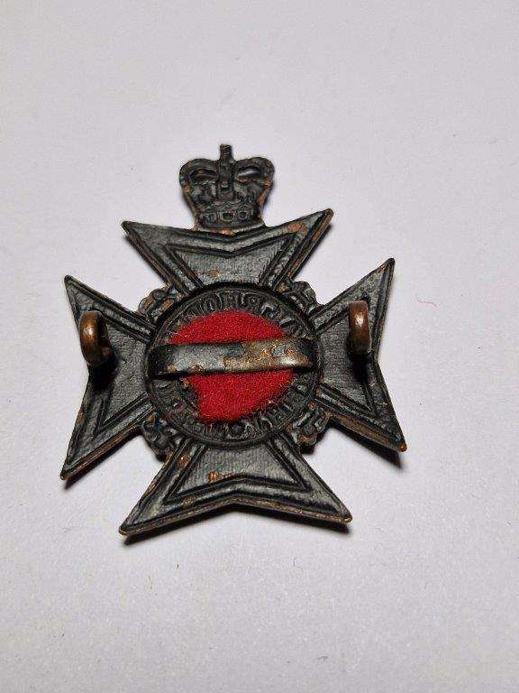 Royal Rhodesia Regiment cap badge. Queen's crown