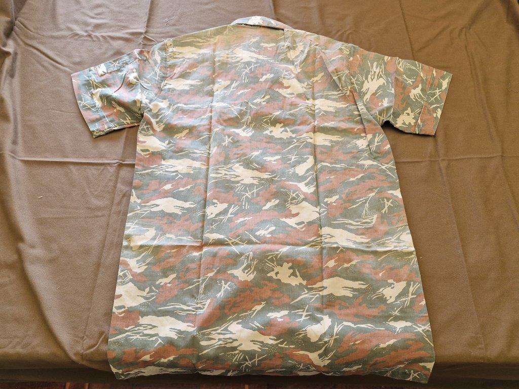 SWAPOL Camo Shirt. 52 CM armpit to armpit. Has tears.
