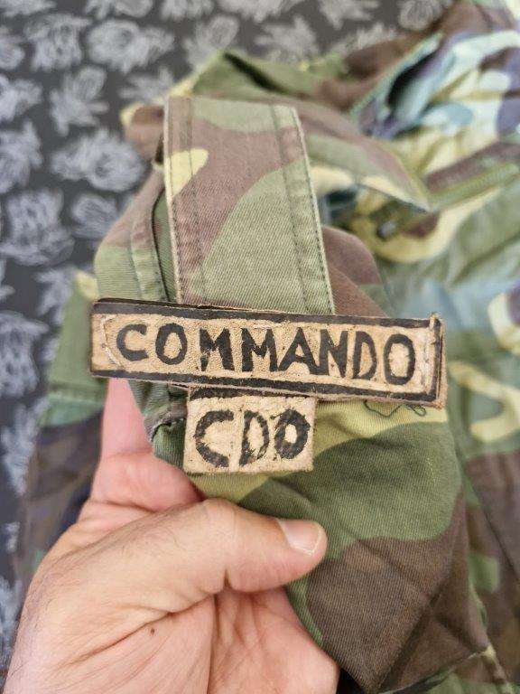 Unknown Camo Jacket with leather Commando Title. 62 Cm Armpit to armpit. Zip broken.