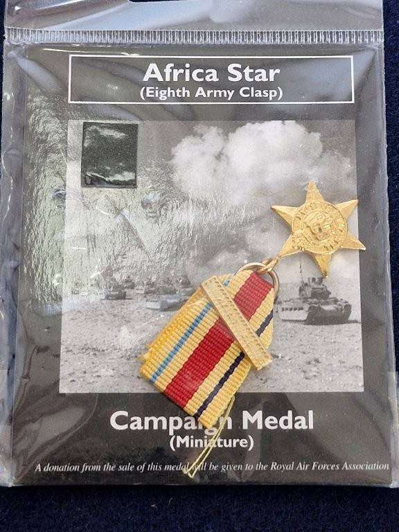 Miniature WWII Africa star with 8th Army clasp. Copy sold by Air Force Museum.