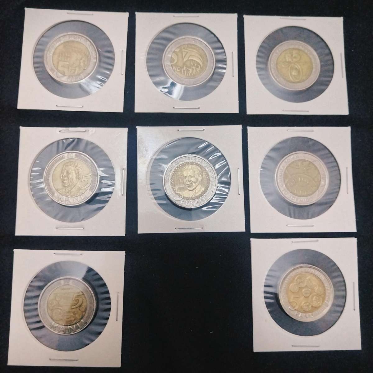 A lot of 9 commemorative R5 coins. Includes a '94 presidential inauguration coin