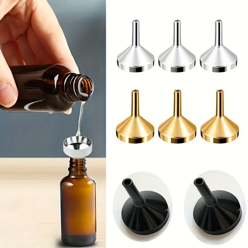 A Set Of Small Golden Funnels Specially Designed For Perfumes And Essential Oils