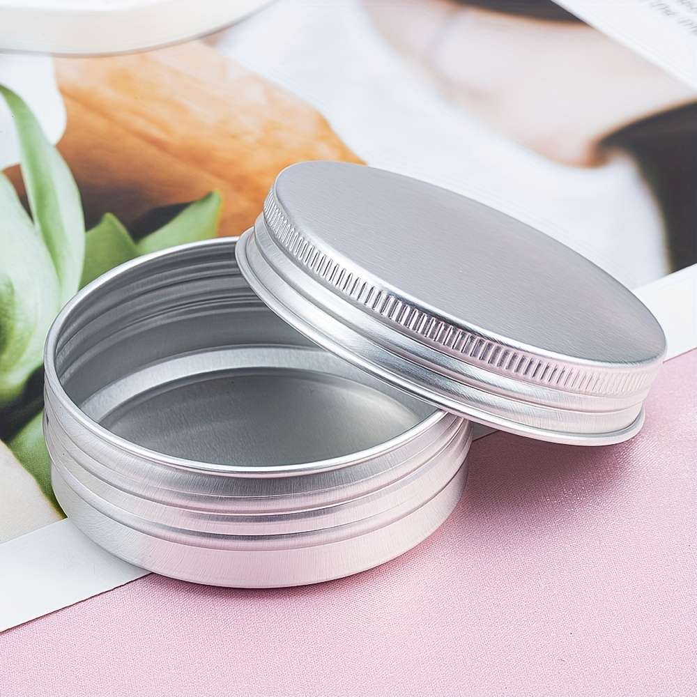 A Circular Aluminum Box With A Threaded Rotating Sealed Lid