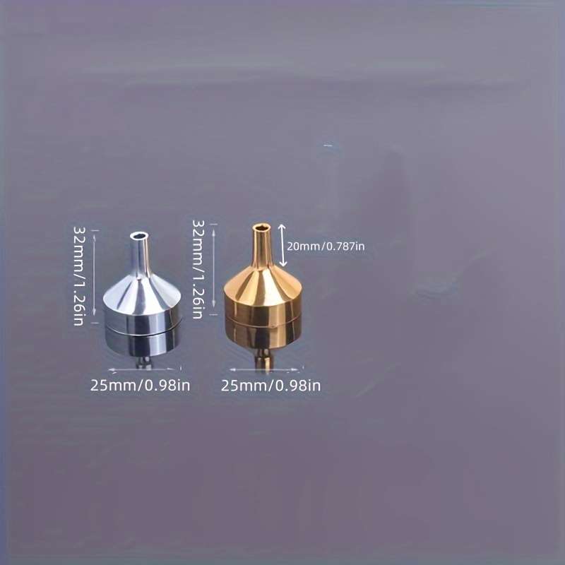 A Set Of Small Golden Funnels Specially Designed For Perfumes And Essential Oils