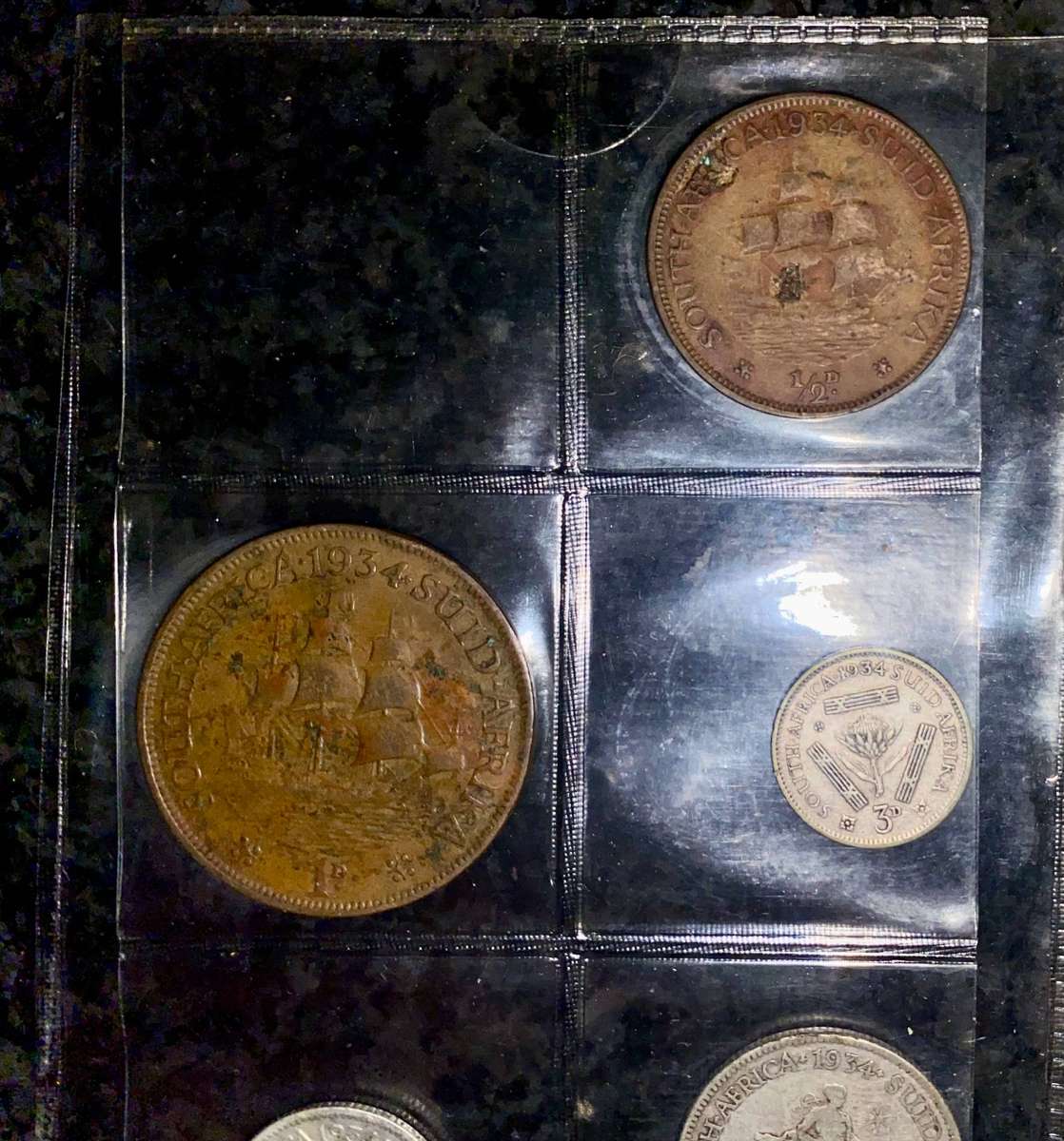 1934 Partial set -- Silver 2 1/2 shillings to 1/2 penny in folder + info card