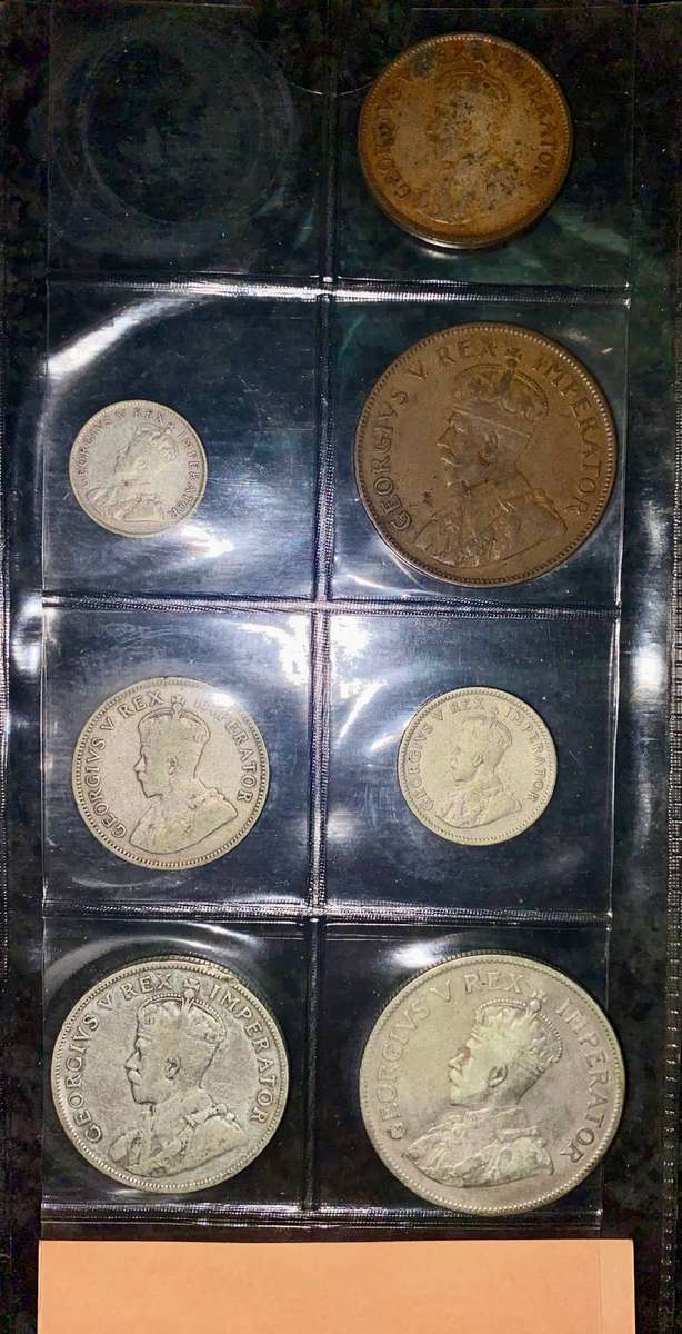 1934 Partial set -- Silver 2 1/2 shillings to 1/2 penny in folder + info card