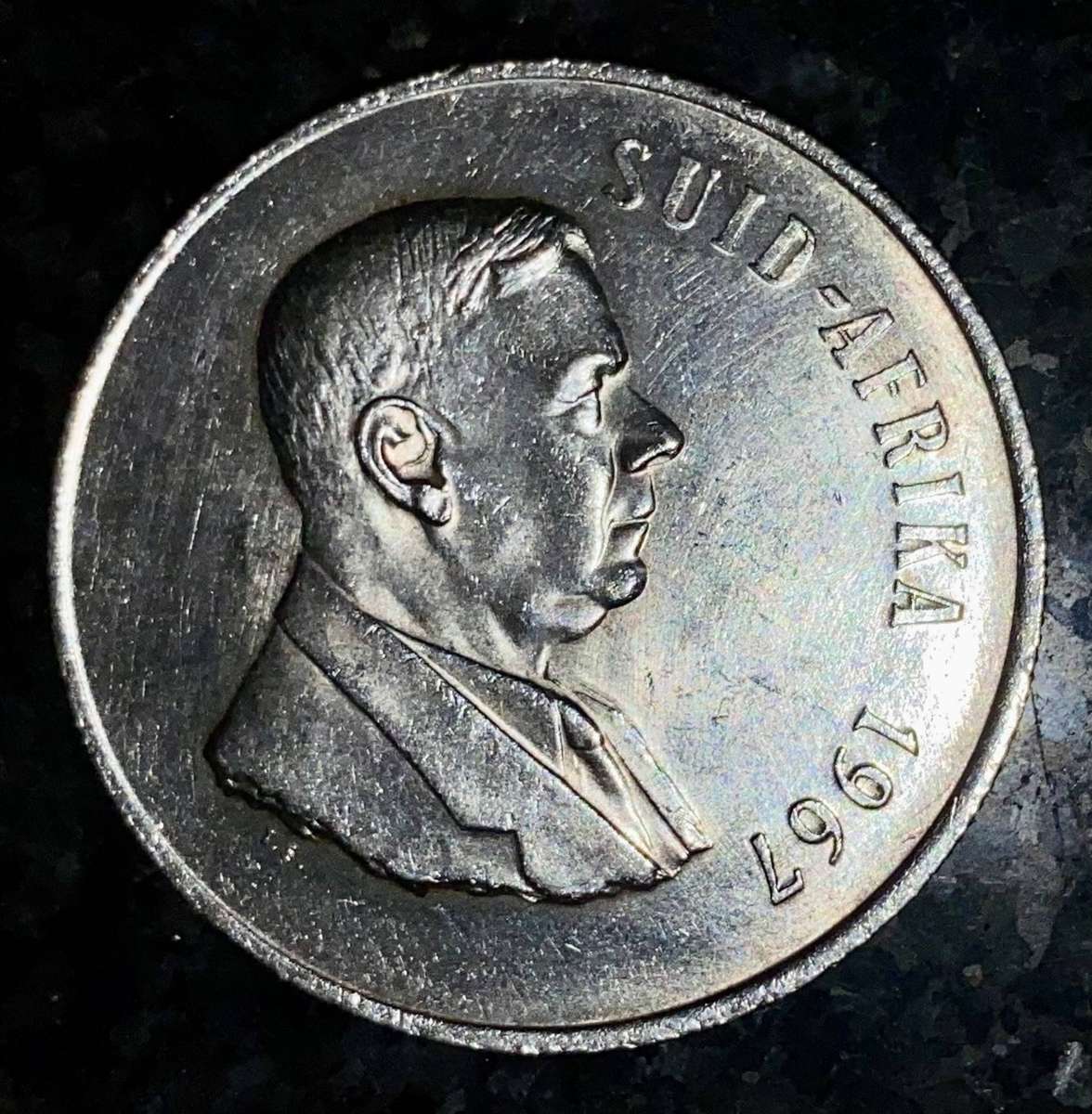 South Africa. Silver R1 -- 1967 Afrikaans good condition.