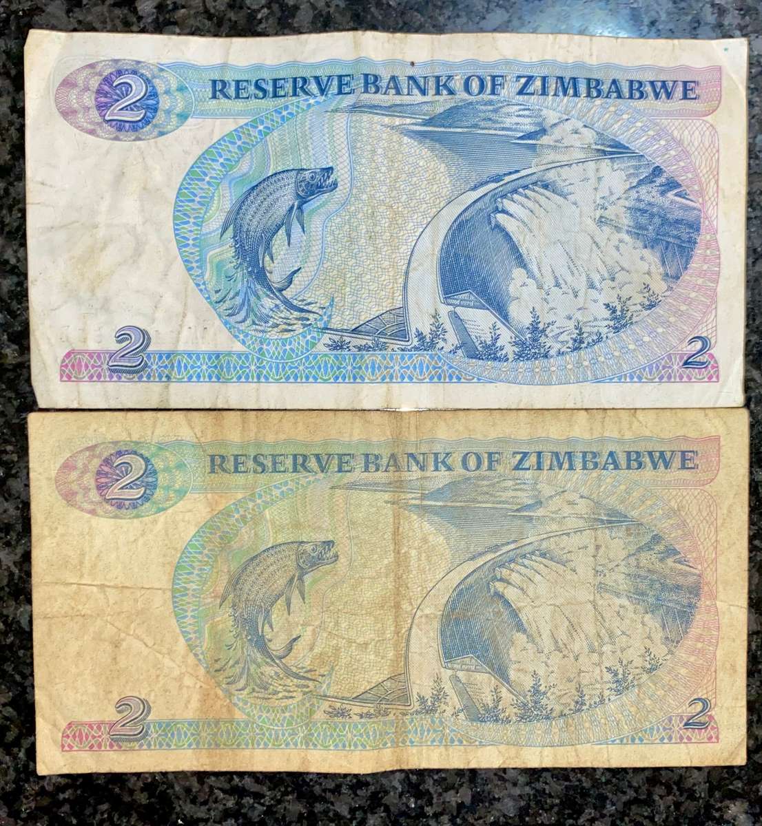Zimbabwe. set 2 dollars two different wtm 1980/1994 (1 bid takes all)