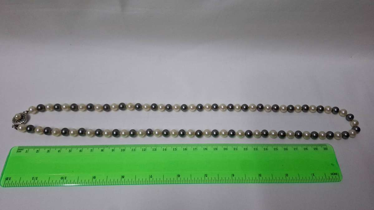 A Stunning String of Pearls with Clasp (33mm length) - Excellent Condition